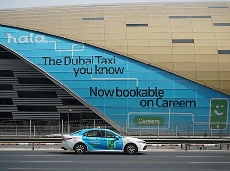 an image of Hala Taxi in front of Metro Station