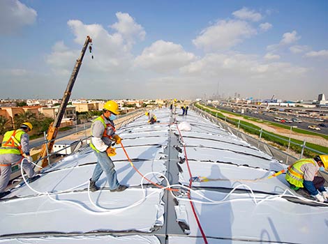 workers on metro station building 