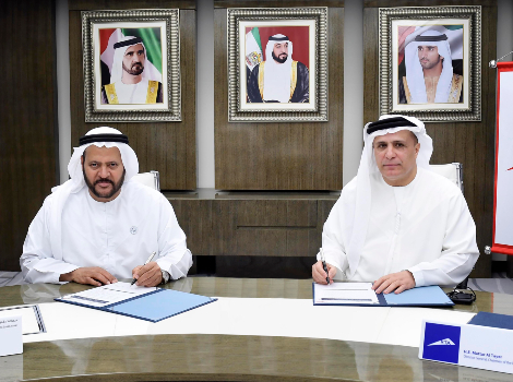 an image of Al Tayer and Al Mazroui during the signing of the Agreement