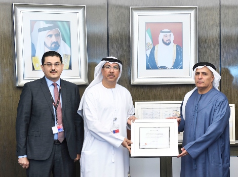 An image of Al Tayer receiving the Certificate from Abdullah Al Jawi