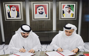 Al Tayer and Bin Huwaireb signing the MoU