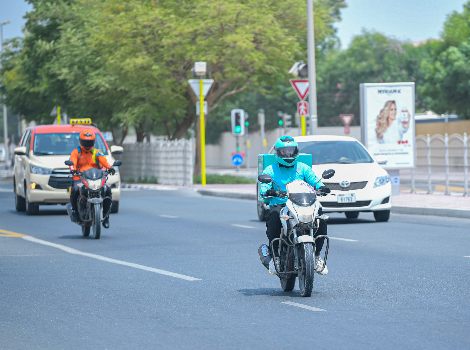 an image of delivery bike drivers