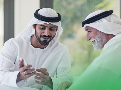 an image of an Emiratis, Senior using smart mobile