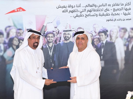 an image of Al Tayer and Al Shaibani signing the agreement 