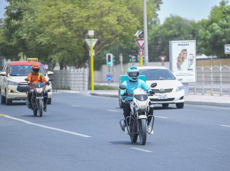 an image of delivery motorbike drivers