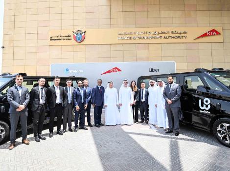 an image of Al Tayer, Madhu and Ryan witnessing the signing of the MoU