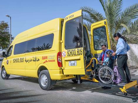 an image showing Dubai Taxi's school bus service for students of determination
