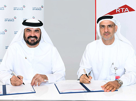 Ahmed Bahrozyan signing the Agreement (right) with Mohammed Al Muallem (left)