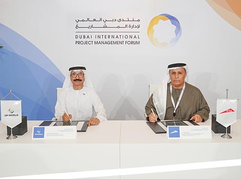 an image Al Tayer and Bin Sulayem signing the MoU