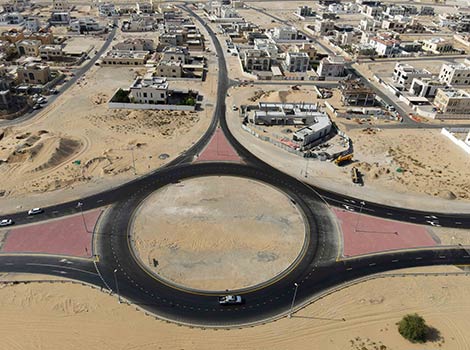 an image of work progress in internal roads at Al Khawaneej 2