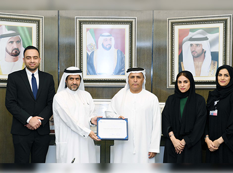 an image of receiving Dubai Chamber of Commerce CSR Label award 
