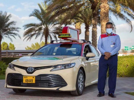 an image of Dubai Taxi driver to serve Global Village visitors
