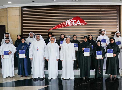 an image of Al Tayer amid graduates