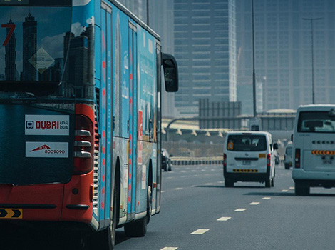 an image of Dubai bus on the road
