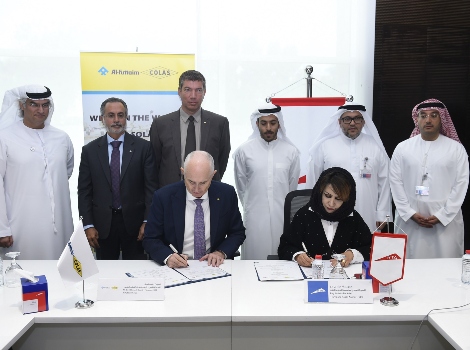 an image while signing the MoU with Al-Futtaim Colas LLC for researching sustainable transport infrastructure